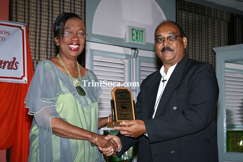 Minister Joan Yuille Williams receives an award on behalf of the Ministry of Community Development