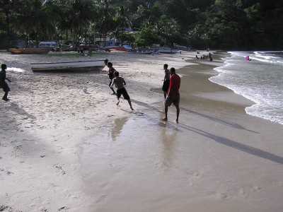 Villagers play on the beach